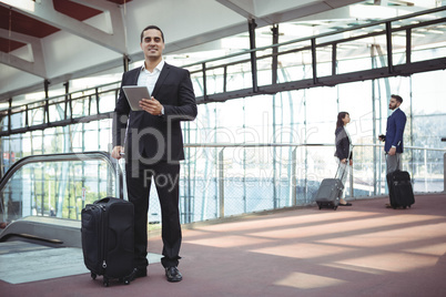 Businessman using digital tablet on platform