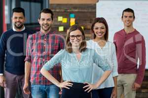 Smiling businesspeople standing in office