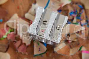 Sharpener and various colored pencil shavings