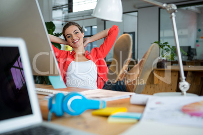 Female graphic designer relaxing on chair