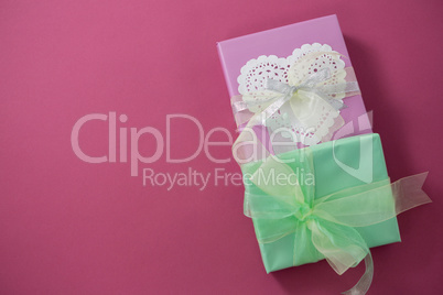 Gift boxes against pink background
