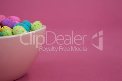 Colorful chocolate Easter eggs in a bowl