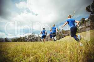Fit people running in bootcamp