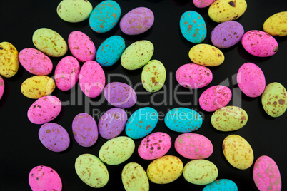 Multicolored Easter eggs on black background