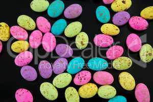 Multicolored Easter eggs on black background