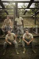 Soldiers sitting on the obstacle course in boot camp