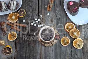 cup of hot black coffee on a gray wooden surface