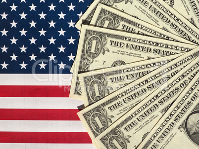 Dollar notes and flag of the United States