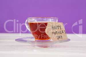 Happy mothers day card with cup of herbal tea