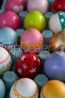 Colorful Easter eggs in egg carton