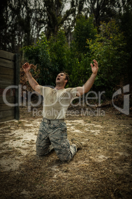 Soldier screaming with arms wide open