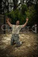 Soldier screaming with arms wide open