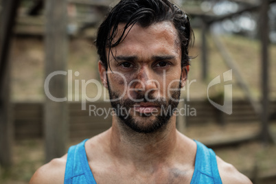 Portrait of determined man in boot camp training