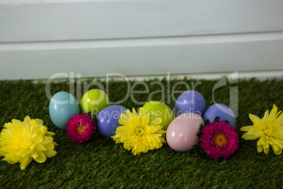Multicolored Easter egg on grass