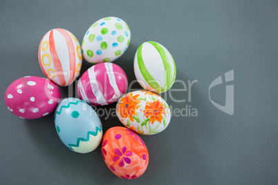 Multicolored Easter eggs on grey background