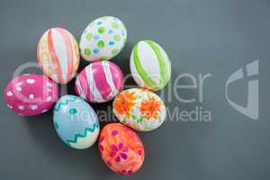 Multicolored Easter eggs on grey background