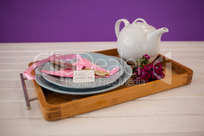 Happy mothers day card with teapot on wooden tray