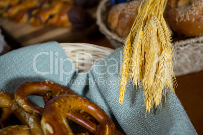 Ears of wheat and pretzel breads at counter