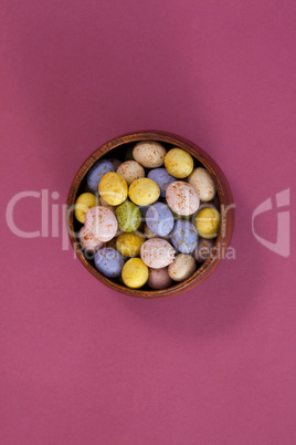 Colorful chocolate Easter eggs in a bowl