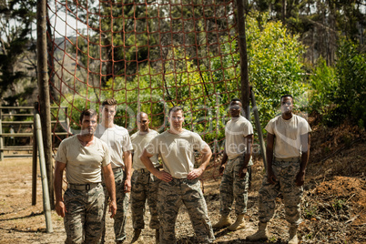 Military soldiers standing near fitness trial