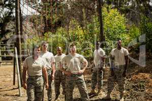 Military soldiers standing near fitness trial