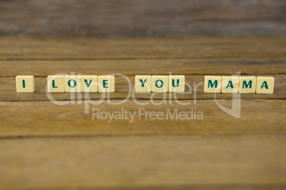 I love you mom block on wooden background