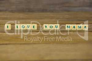 I love you mom block on wooden background