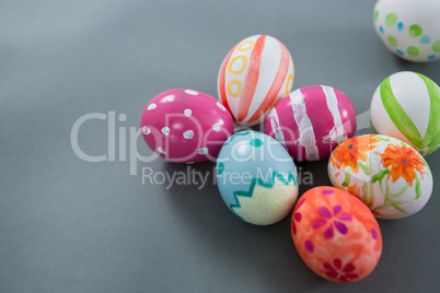 Multicolored Easter eggs on grey background