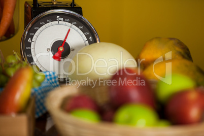 Close-up of weighing scale and fruits in organic section