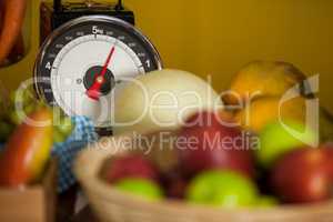 Close-up of weighing scale and fruits in organic section