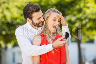 Man proposing a woman with a ring