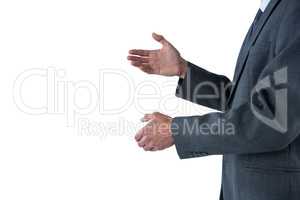 Mid section of businessman gesturing