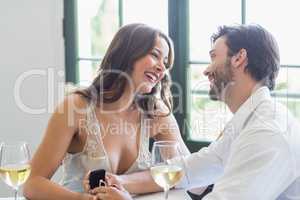 Couple smiling while looking at each other