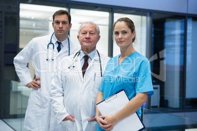 Doctors and surgeon standing together in hospital