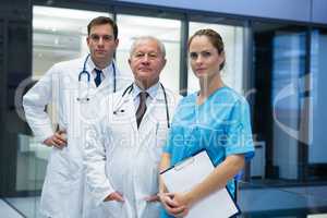 Doctors and surgeon standing together in hospital
