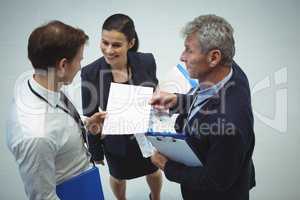 Businesspeople having discussion over document
