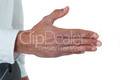 Mid section of executive his hand for offering handshake