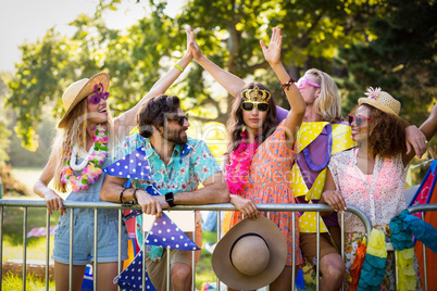 Group of friends dancing at music festival