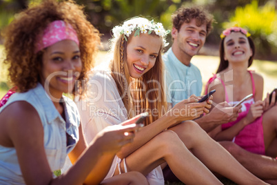 Group of friends using mobile phone