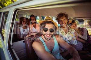Group of friends travelling in campervan