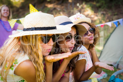 Group of friends blowing kiss