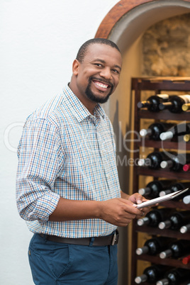 Happy man using digital tablet in the restaurant