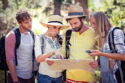 Group of friends looking at map