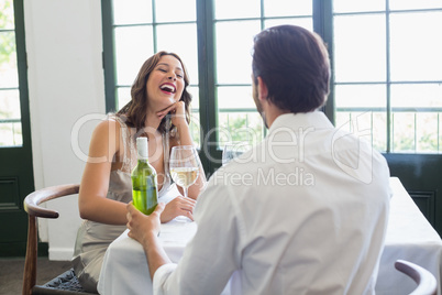 Couple laughing while sitting