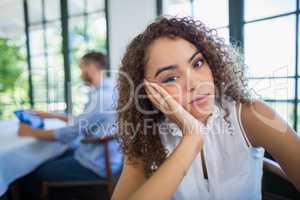 Upset woman sitting in a restaurant
