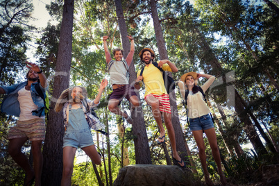 Group of friends having fun in forest