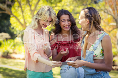 Friends looking at mobile phone Friends looking at mobile phone