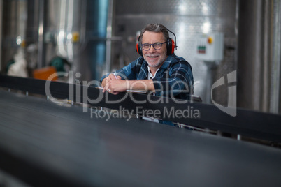 Male factory worker at drinks production factory