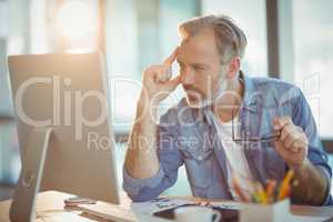 Male graphic designer working on computer