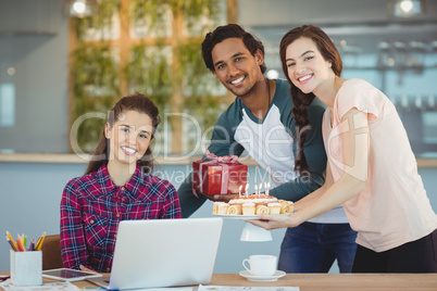 Business executives celebrating their colleagues birthday